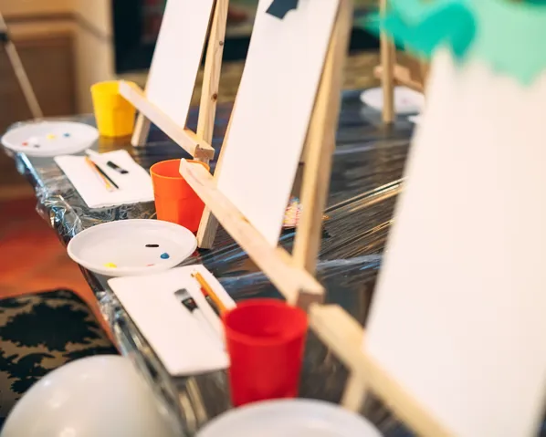 Therapeutic activities including painting and a blank canvas
