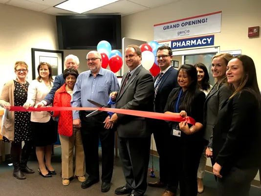 Genoa Pharmacy Ribbon Cutting 2019 with a large crowd