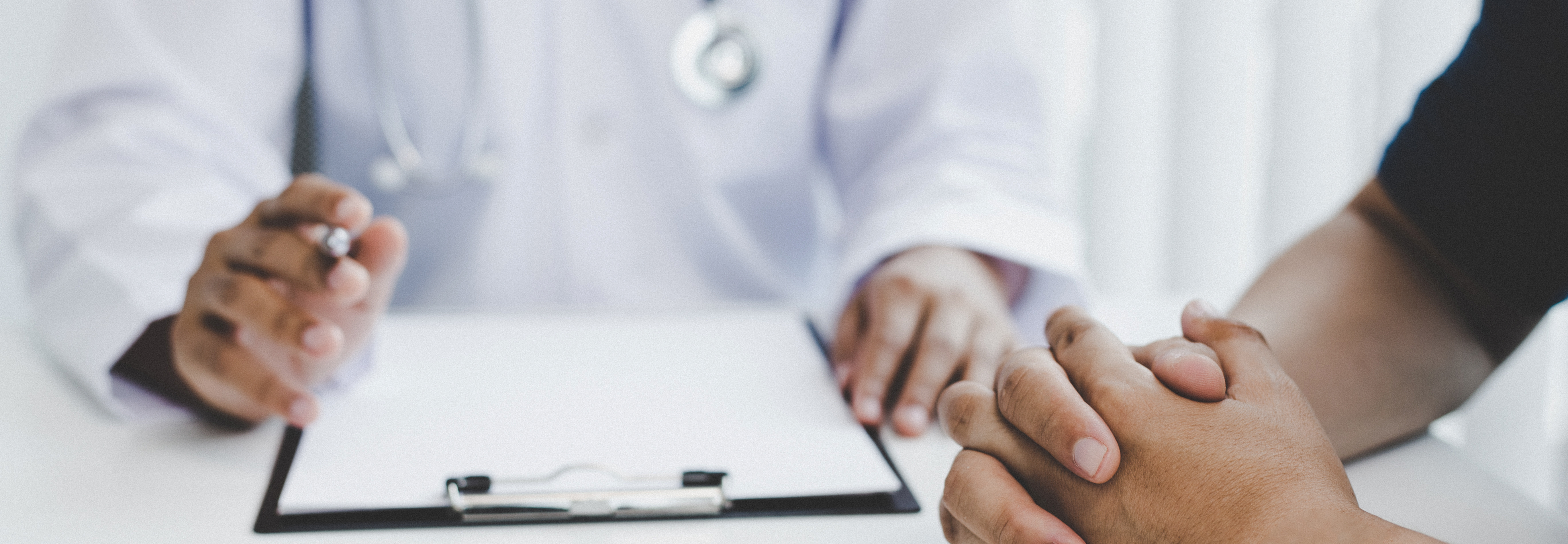 Psychiatric services with a doctor and a clipboard next to a patient