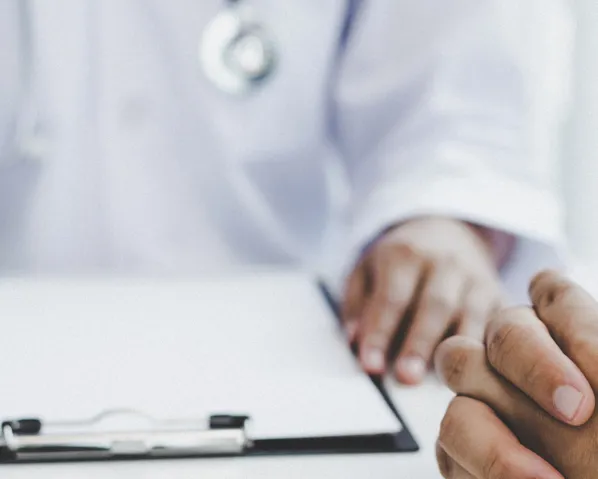 Psychiatric services with a doctor and a clipboard next to a patient