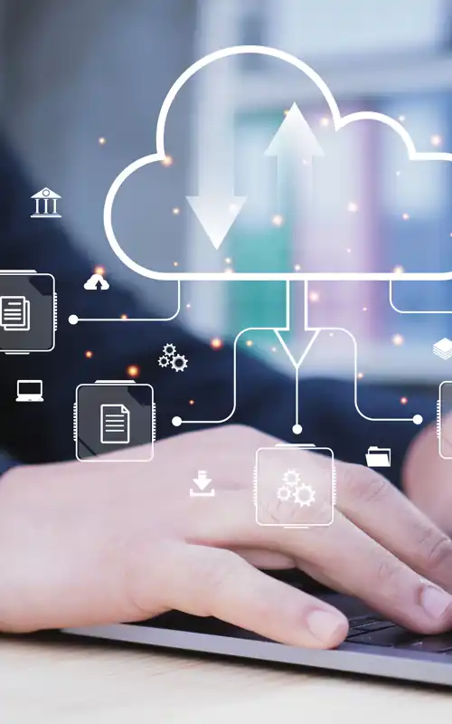 An employee with laptop with an image of the cloud and resources