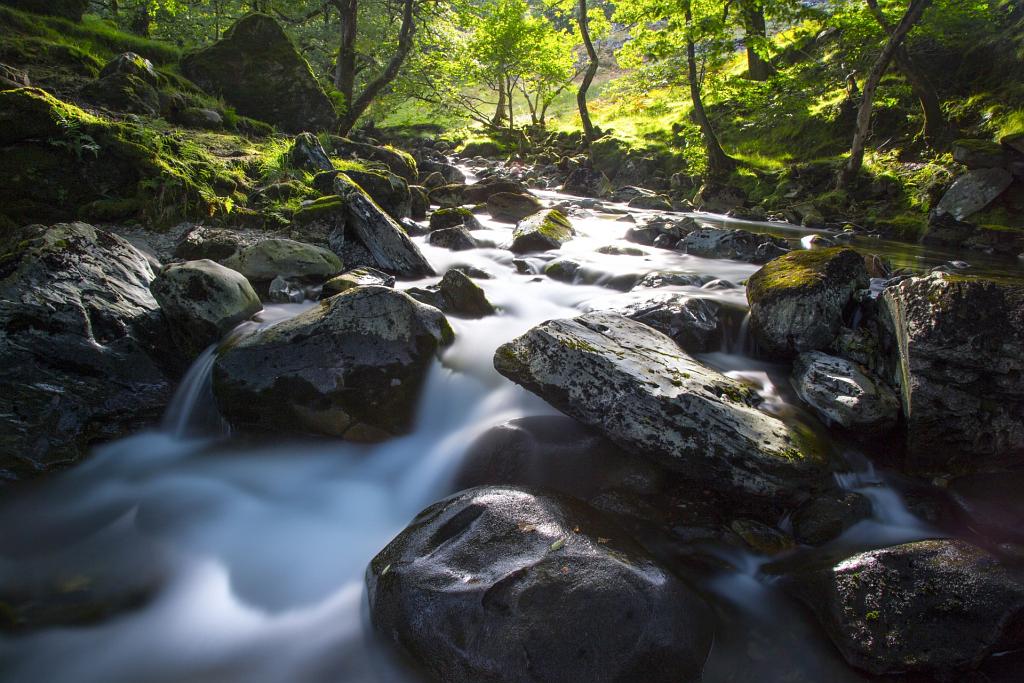 water stream passing through the mountains