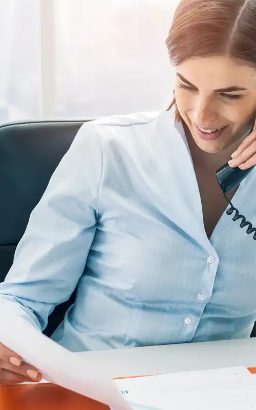 A woman taking an emergency call and offering help